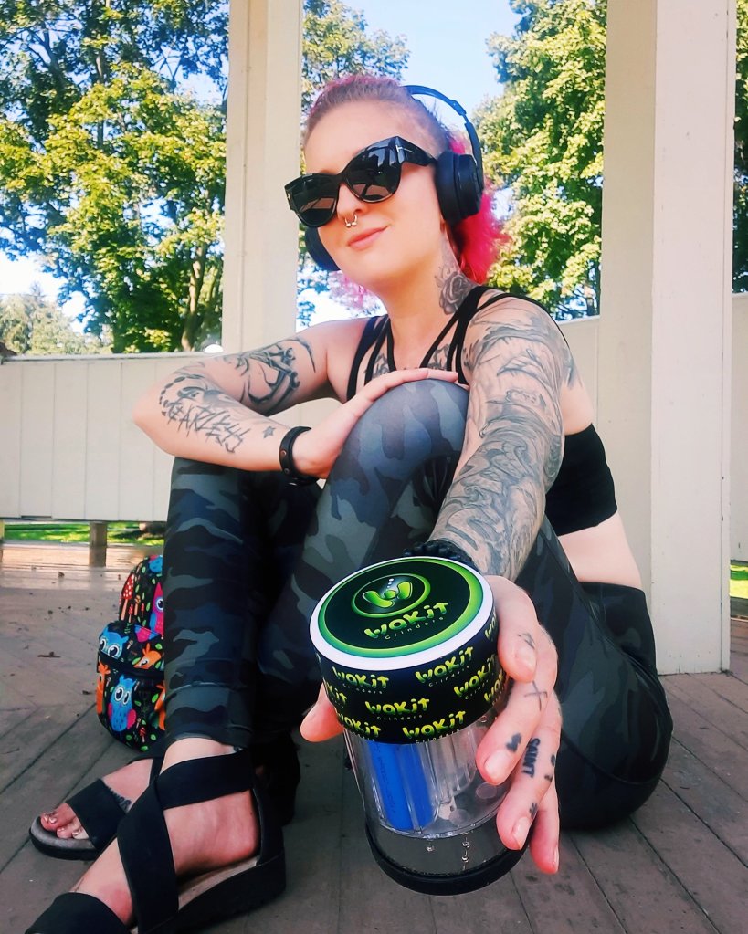Kae Audhild holding Wakit electric herb grinder, KLR lucid