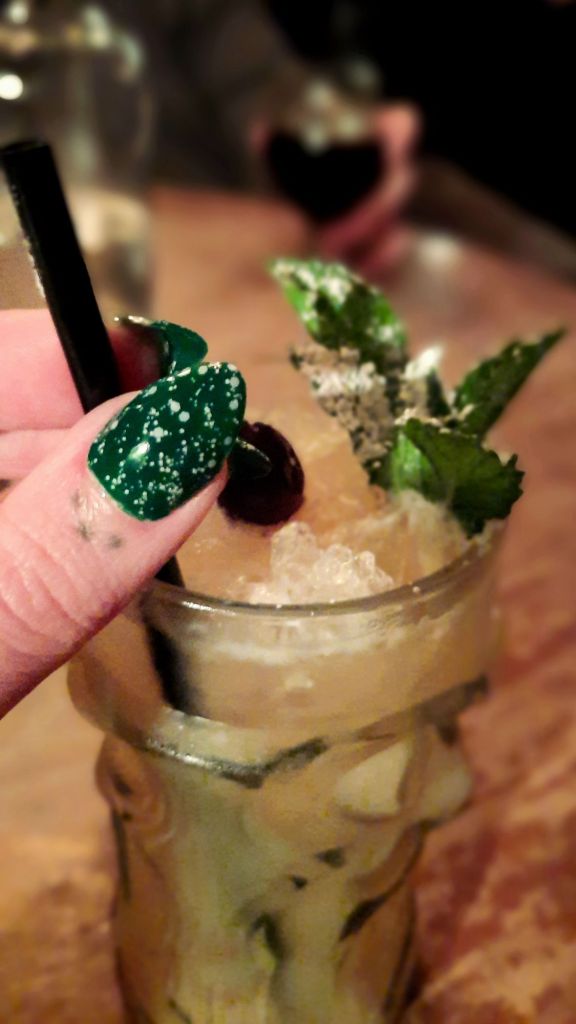 Kae Audhild's 2024 Jul Yule Christmas holiday nails - short almond diy gel nails - green base with white snow glitter