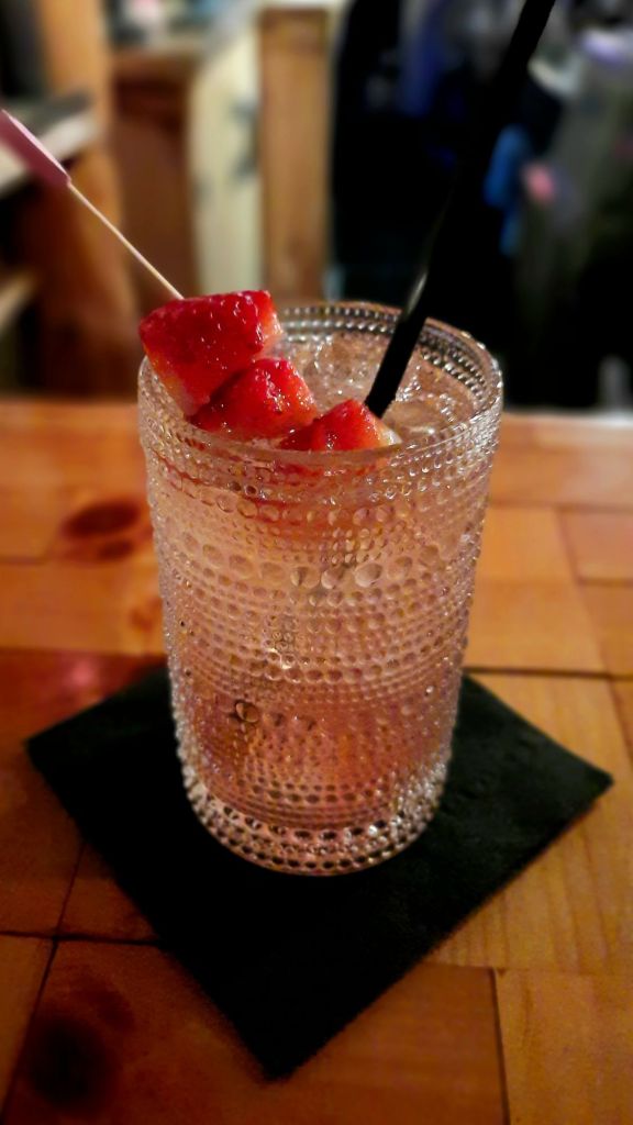 Valentine's cocktail at MJ's in Owego, NY: Lavender Love Spell - Tequila Reposado, Chambord, lavender, citrus and Prosecco, on the rocks, strawberry garnish