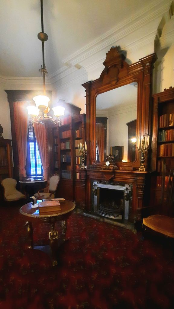 The library is a bit dark and has an eerie vibe to it. The woodwork is stunning, and there are so many interesting things to look at. Phelps Mansion Museum in Binghamton NY