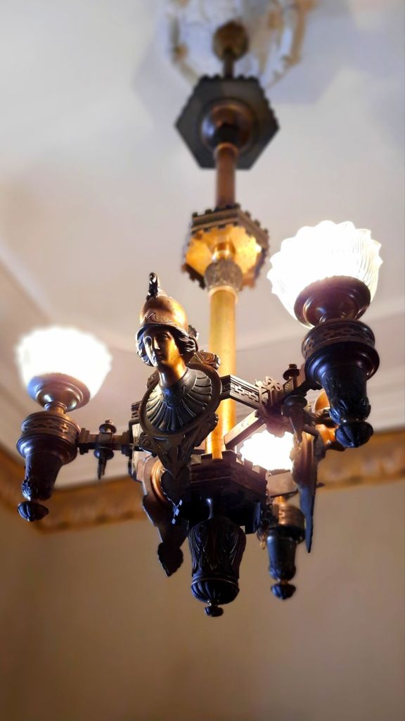 Receiving room chandelier in Phelps Mansion Museum in Binghamton, NY - Athena the Greek goddess of wisdom, war, and handicraft - things to do in Binghamton, New York
