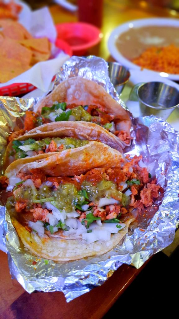 Tacos de Alambre - 3 tacos with grilled chicken, chorizo, bacon, and grilled onions - side of rice and refried beans - Hacienda Mexican Restaurant in Binghamton, New York