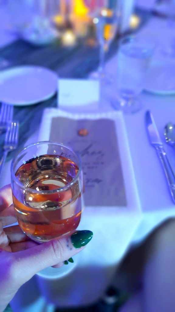 Kae Audhild went to a wedding in April 2025 and had the best time with friends - meeting new friends - open wine bar - white zinfandel 