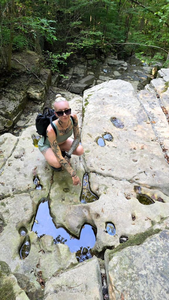 The waterfalls are currently dried up at Three Falls Woods, but check out these potholes! - Kae Audhild New York hiking travel blogger 