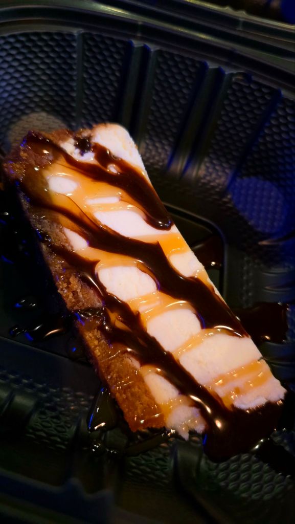 Cheesecake (to go) - cheesecake with chocolate syrup and house caramel - The Grove in Binghamton, NY - Restaurant Week 2025 