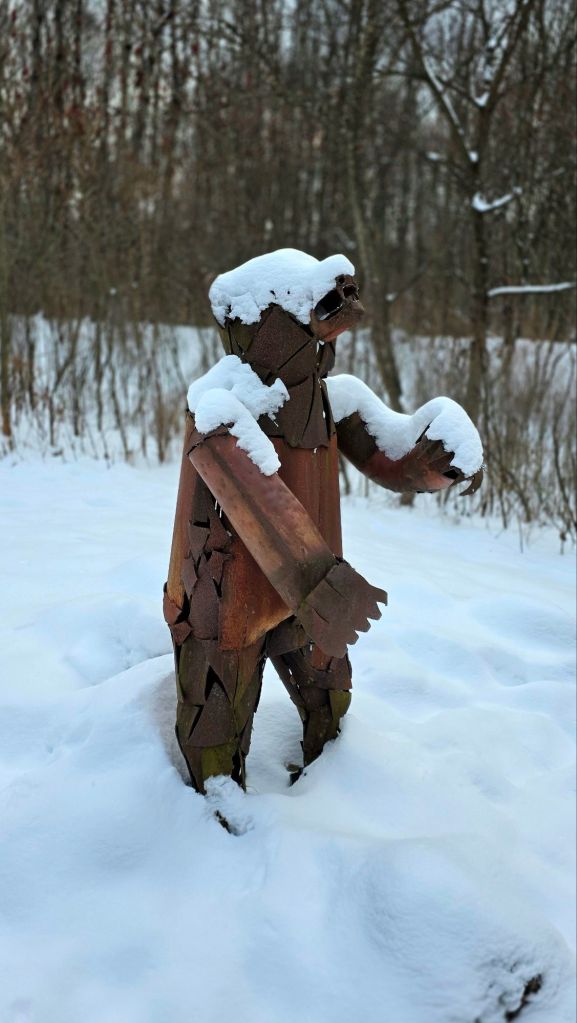 Metal bear sculpture along the art trail at Lime Hollow Nature Center in Cortland NY 
