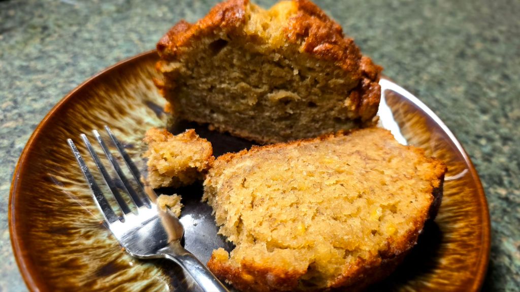 Sweet Brown Sugar Banana Bread Recipe - fresh banana bread on a small plate cross-section close-up - cozy winter evening ideas, hygge vibes - easy breakfast, brunch and dessert ideas