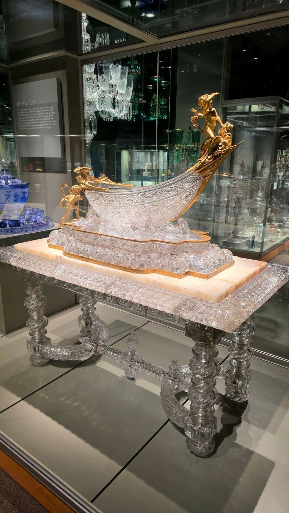 Crystal glass, white marble and gold boat table at Corning Museum of Glass in Corning NY