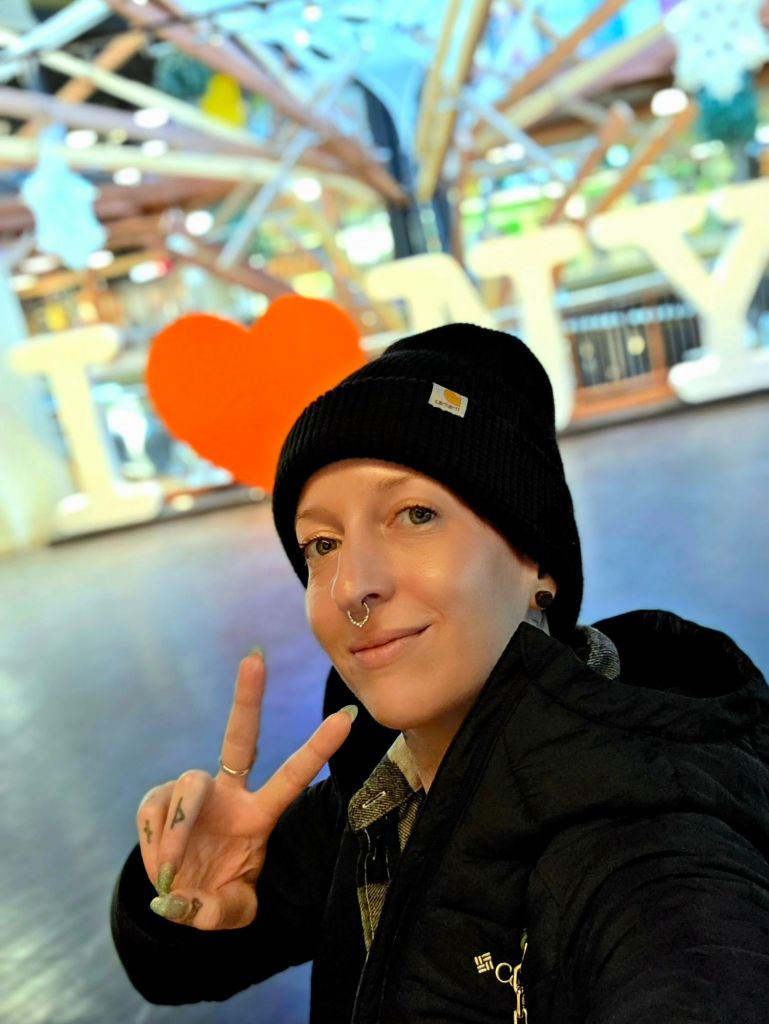 Soft life living means choosing calm, intentional moments — Kae Audhild peace sign New Year’s Day 2026 at Destiny USA in Syracuse NY