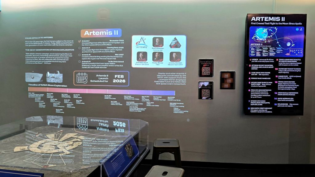 Exhibit display about NASA’s Artemis II mission and moon exploration timeline at the Museum of Science & Technology in Syracuse, New York.